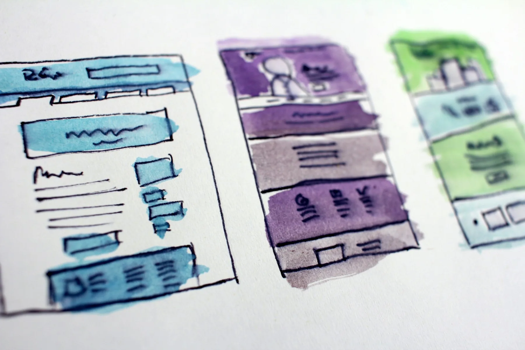 Hand drawn website wireframes showing page layouts and navigation
